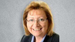 Small headshot of Anne Hutchings