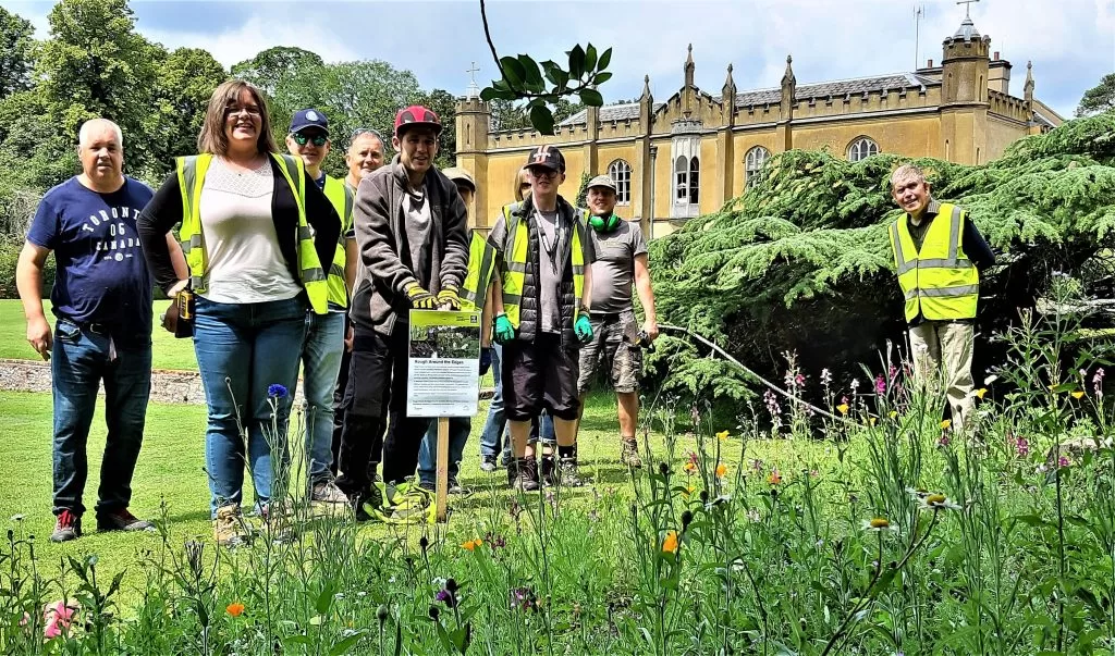 Volunteer gardeners in high vis jackets